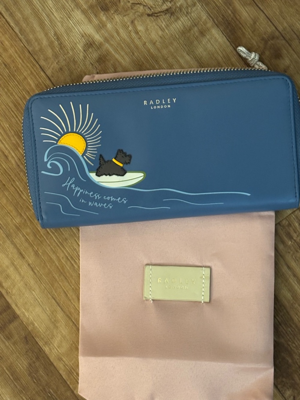 RADLEY LONDON Blue Zip Wallet with Surf Dog and Sun Motif